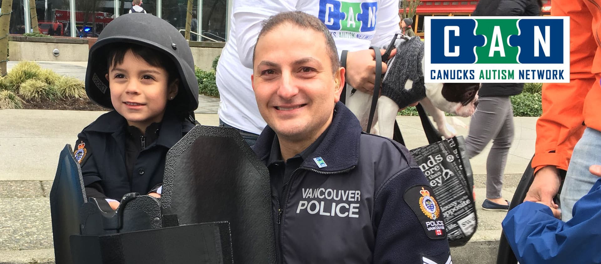 Young boy posing with police officer